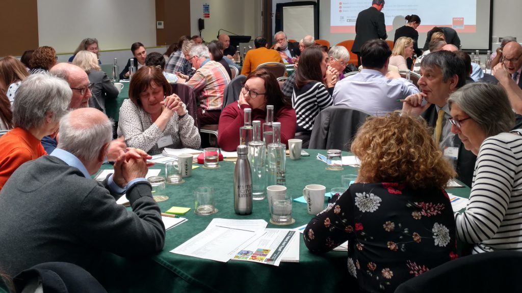 Attendees participating in round table discussions on issues related to sharing patient data